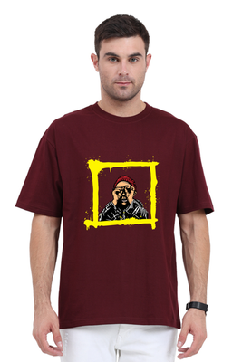 Oversized t-shirt with graphic of character peeking through yellow frame by Rizz Studio