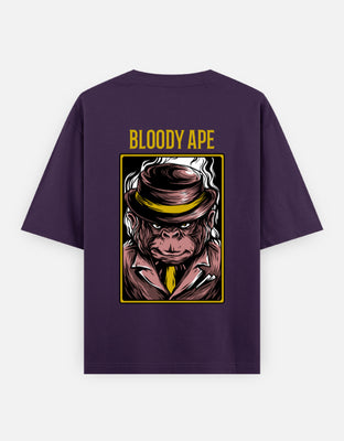 Stylized illustration of a tough-looking ape in a maroon mobster suit and fedora, with a golden tie and intimidating stare, framed in bold yellow.