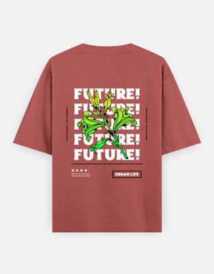 Oversized t-shirt featuring bold repeated typography “FUTURE!” in white, overlaid with neon green botanical illustration, and small text reading “Urban Life.”