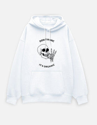 White oversized hoodie featuring a minimalist skull and skeletal hand illustration with the text “DON’T PANIC IT’S ORGANIC” printed on the front.