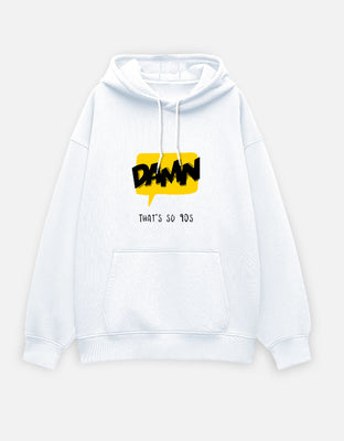 Oversized white hoodie with a yellow speech bubble graphic reading “DAMN” in bold black letters and the caption “That’s So 90s.”