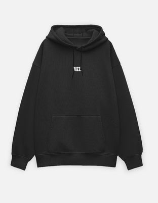 Oversized black hoodie with a small centered embroidered wordmark reading “RIZZ.”