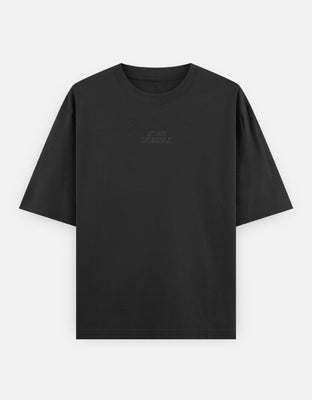 Minimalist oversized t-shirt with the bold typography "Stay Humble" printed in outline font — a clean, grounded aesthetic with timeless appeal.