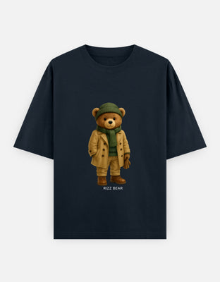 Oversized t-shirt featuring a teddy bear in winterwear – camel trench coat, green beanie and scarf, boots, and gloves.