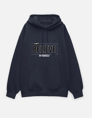 Oversized black hoodie with bold motivational text “Always Believe In Yourself” in a modern outlined design.