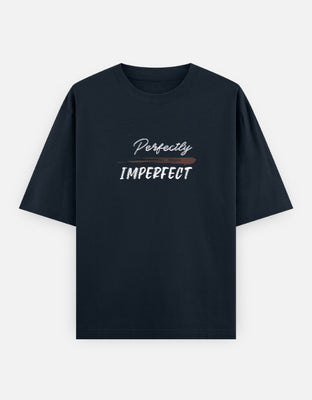Oversized t-shirt with handwritten script and bold typography reading “Perfectly Imperfect,” accented by a brown brushstroke across the design.