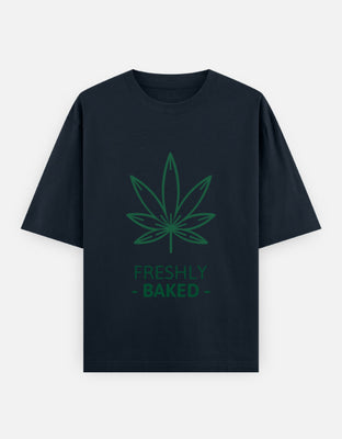 Minimalist green cannabis leaf line-art above the words “Freshly Baked” – modern stoner graphic on a clean background.