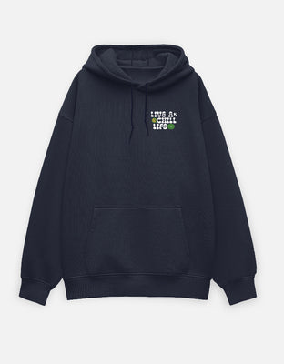 Oversized black hoodie with a small left-chest graphic reading “Live A Chill Life” with flowers and a smiley.