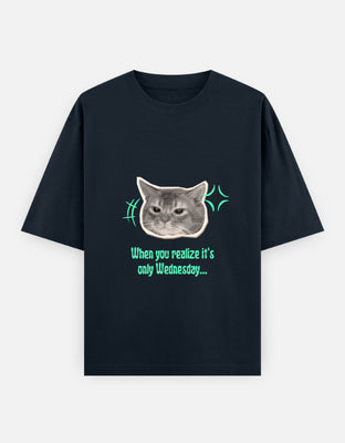 Oversized t-shirt with a grumpy cat graphic and the text When you realize it’s only Wednesday, designed by Rizz Studio.