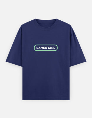 Oversized t-shirt with bold white text reading “Gamer Girl” inside a glowing neon green rounded rectangle frame, minimal futuristic style.